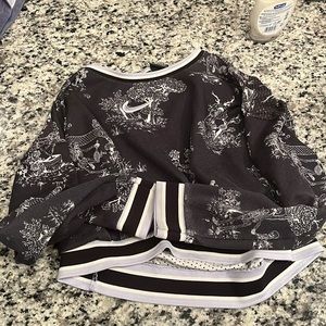 Black and lavender nike cropped long sleeve. Skeleton design.